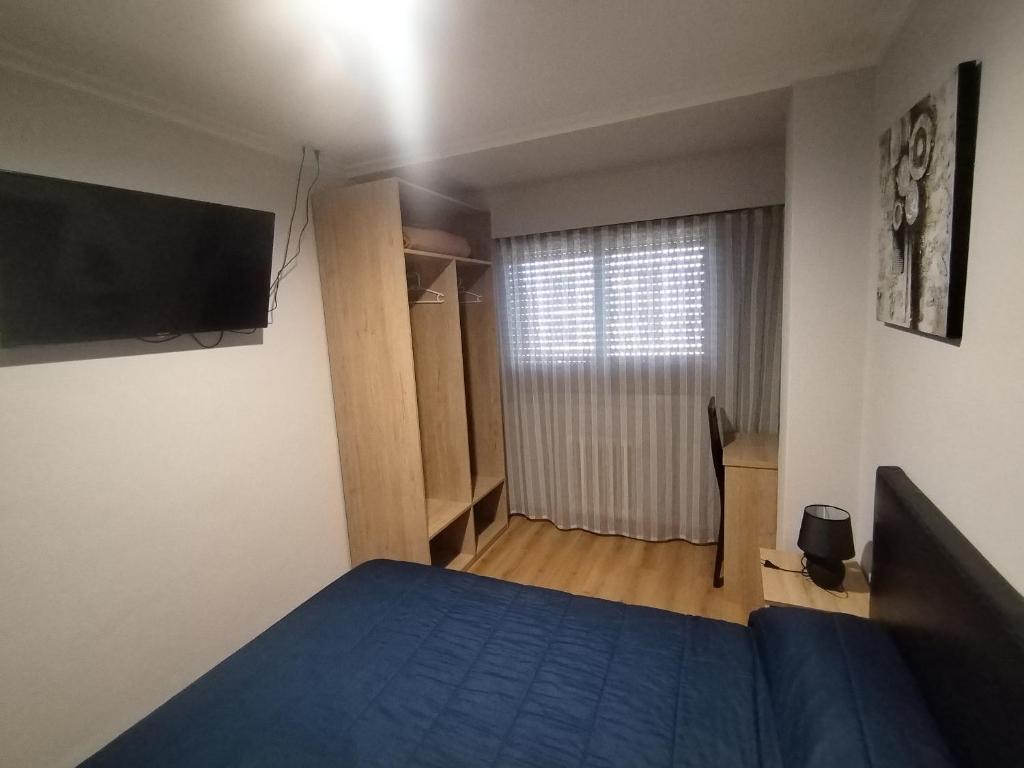 Posteľ alebo postele v izbe v ubytovaní HOSTAL CID