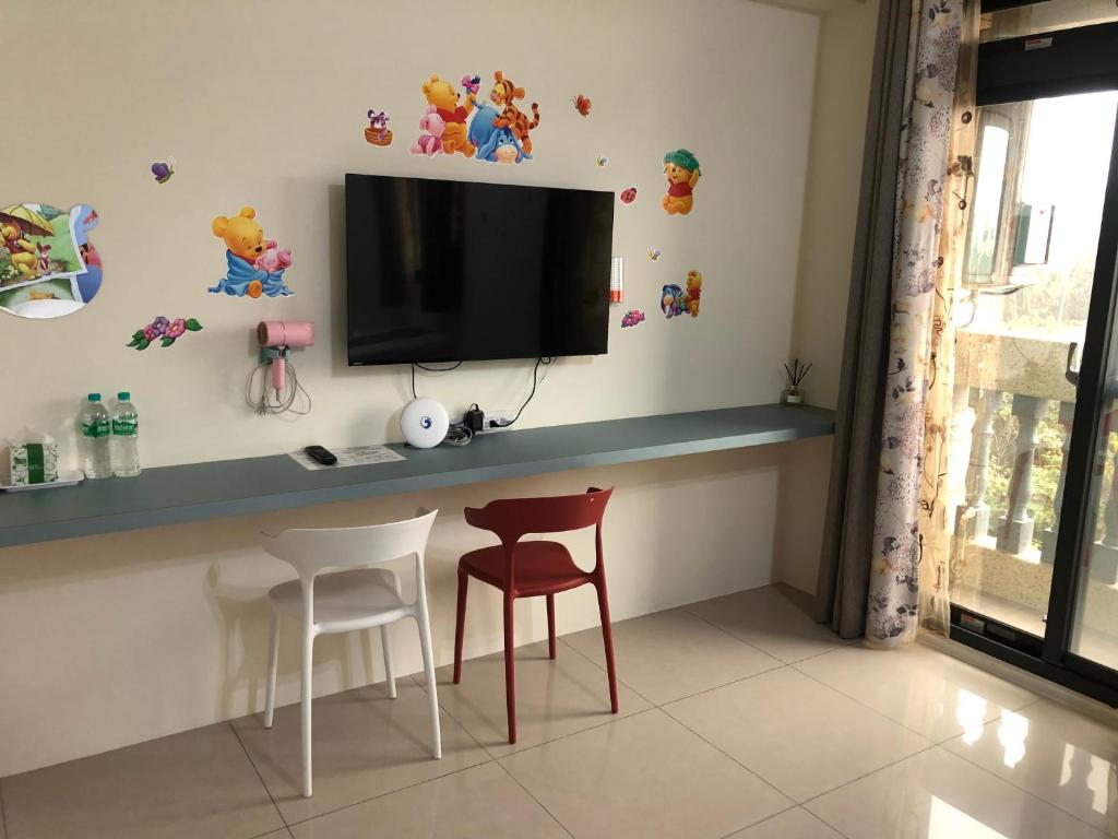 TV a/nebo společenská místnost v ubytování Yuan Dudu Homestay