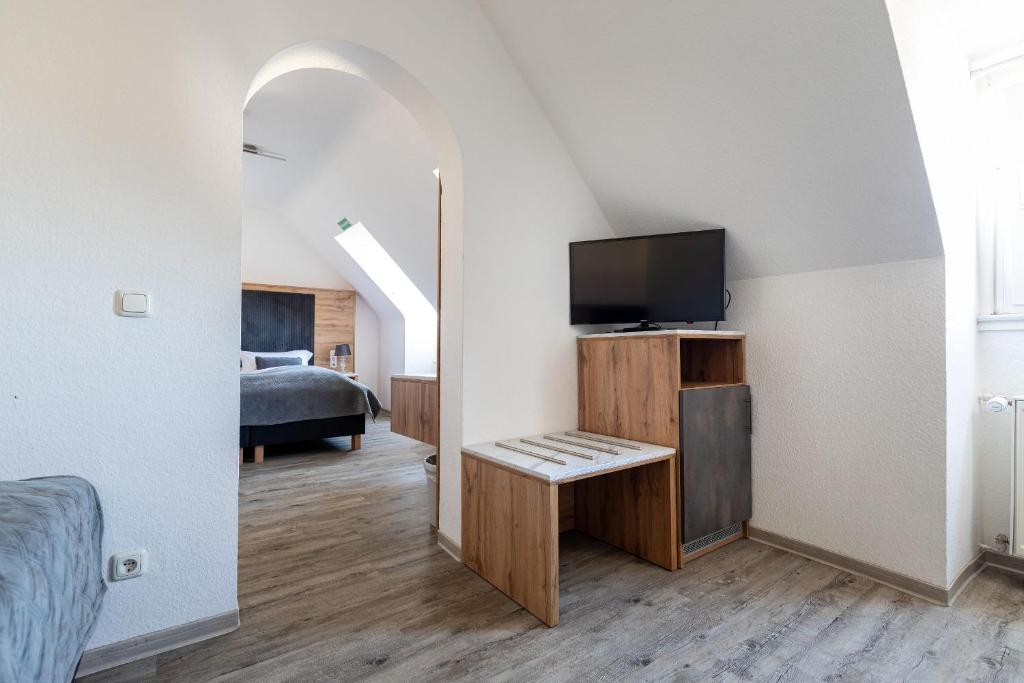 Postel nebo postele na pokoji v ubytování Hotel am Ludwigsplatz