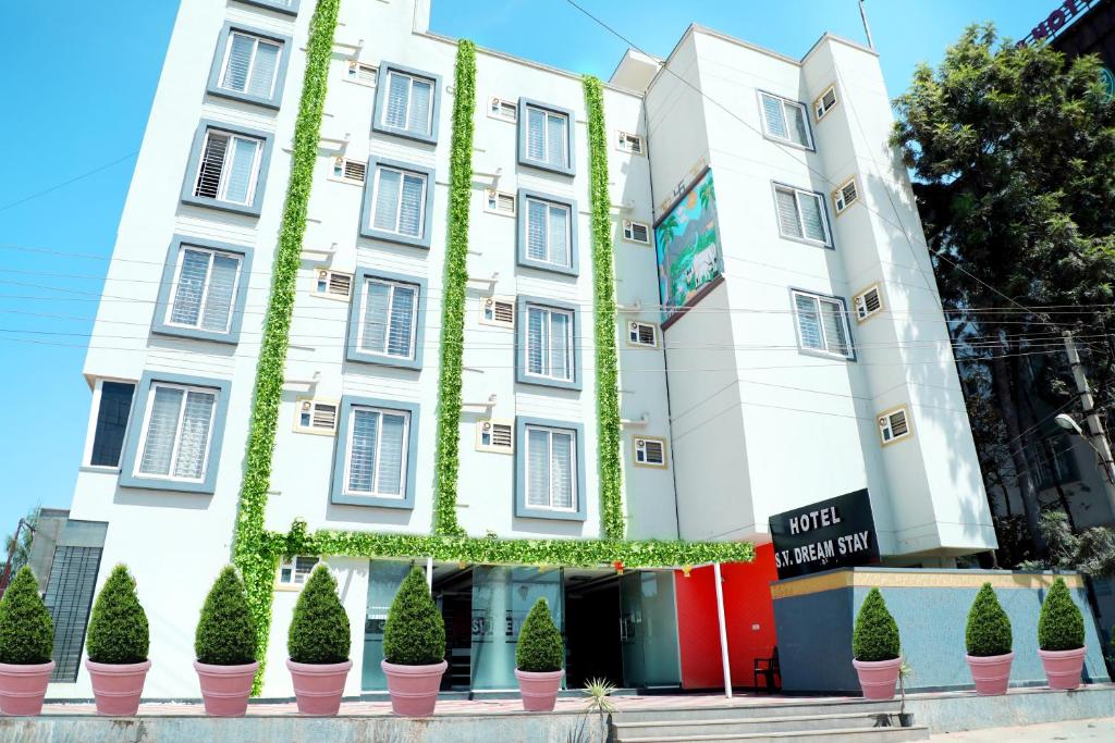 a building with plants growing on it at SV Dreamstay near Kempegowda International Airport in Yelahanka