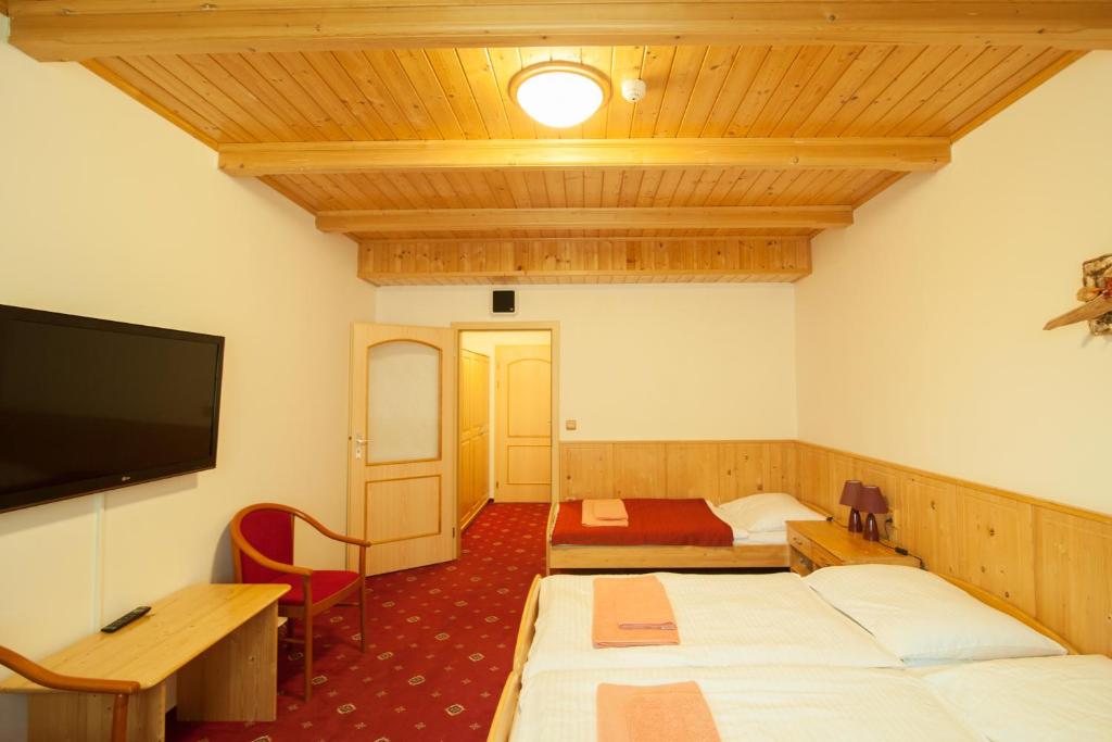 Postel nebo postele na pokoji v ubytování Sport-V-Hotel
