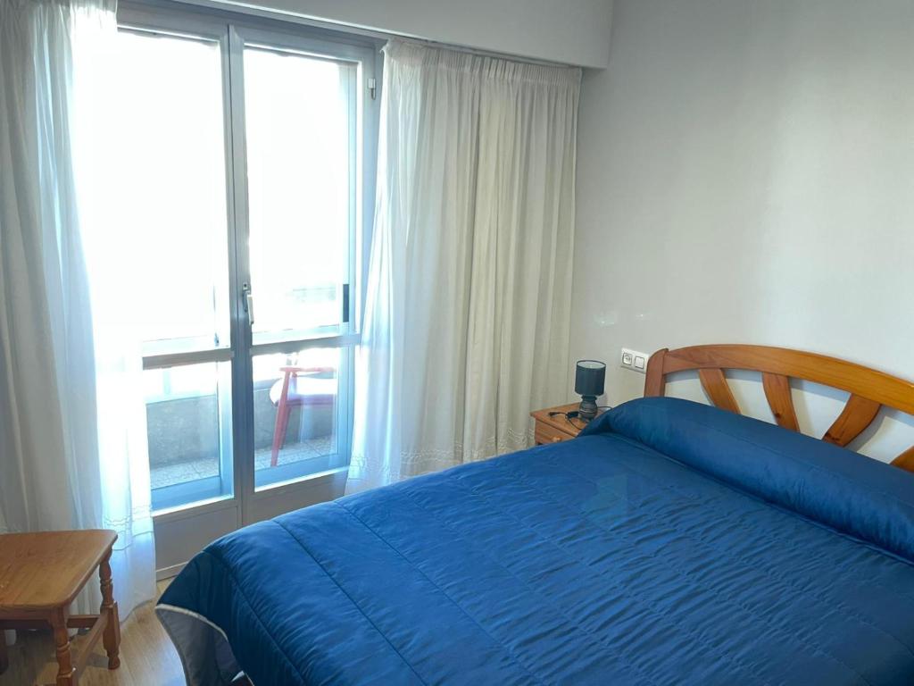 Posteľ alebo postele v izbe v ubytovaní HOSTAL CID