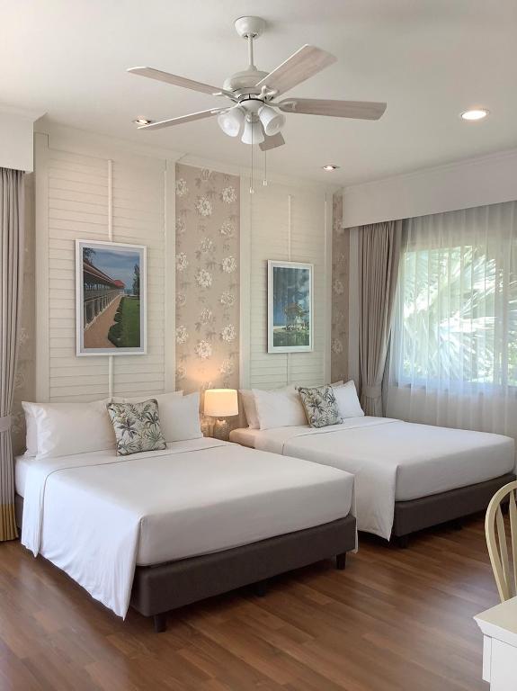 Postel nebo postele na pokoji v ubytování Seapine Beach Golf and Resort Hua Hin