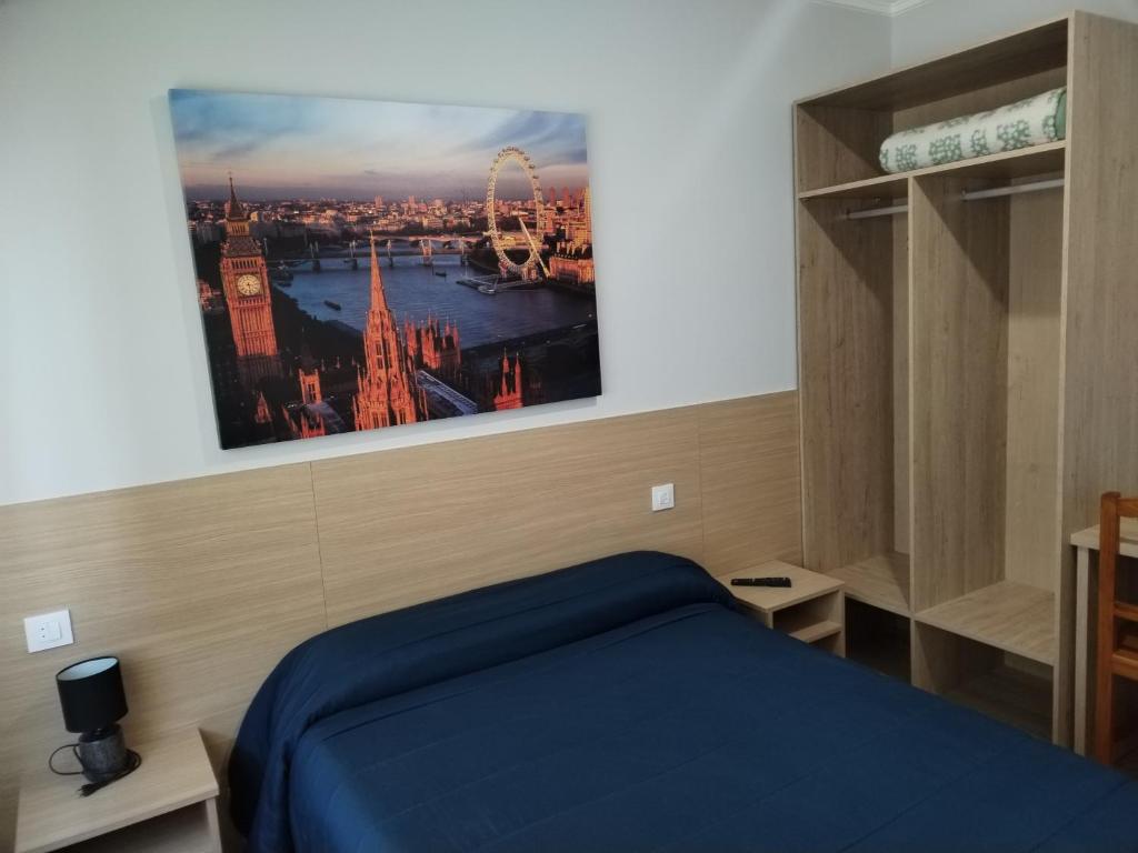 Posteľ alebo postele v izbe v ubytovaní HOSTAL CID