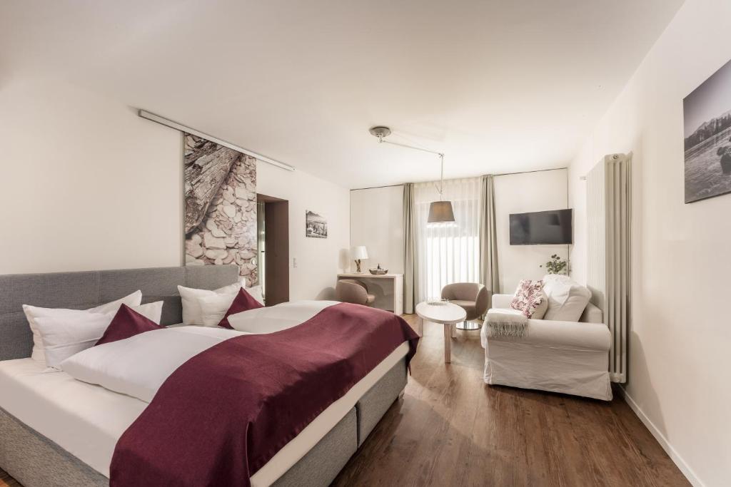 Postel nebo postele na pokoji v ubytování Hotel Villa Lago Garni