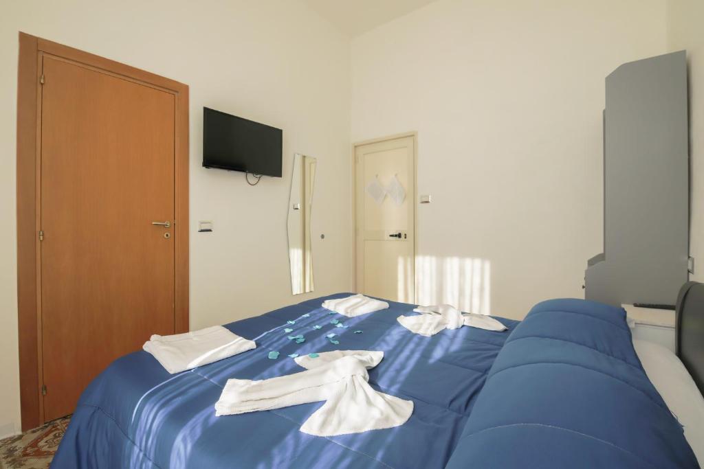 Posteľ alebo postele v izbe v ubytovaní MADB&B