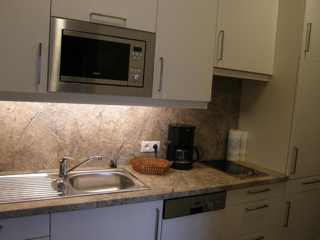 A kitchen or kitchenette at Apartments Karlhof