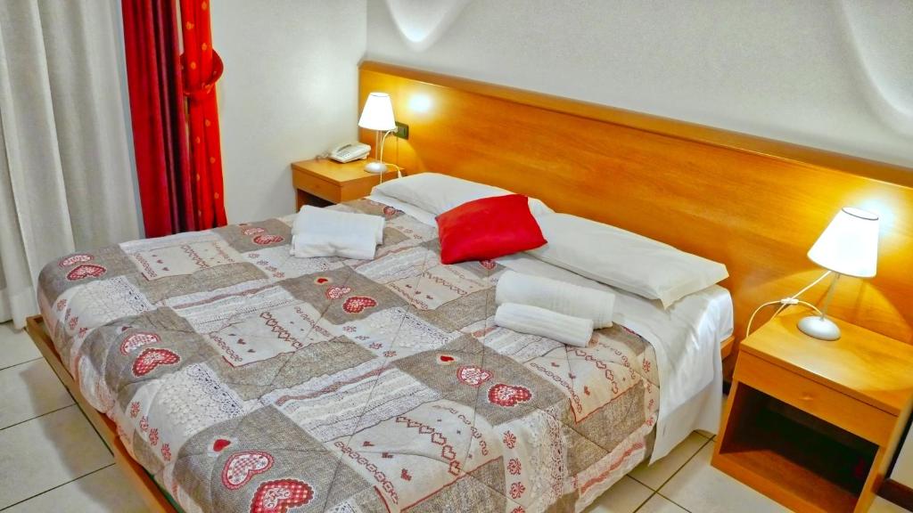 Postel nebo postele na pokoji v ubytování hotel Vajont