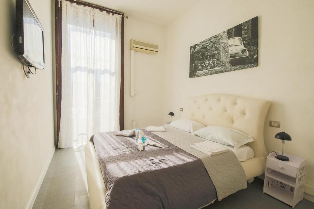Posteľ alebo postele v izbe v ubytovaní MADB&B