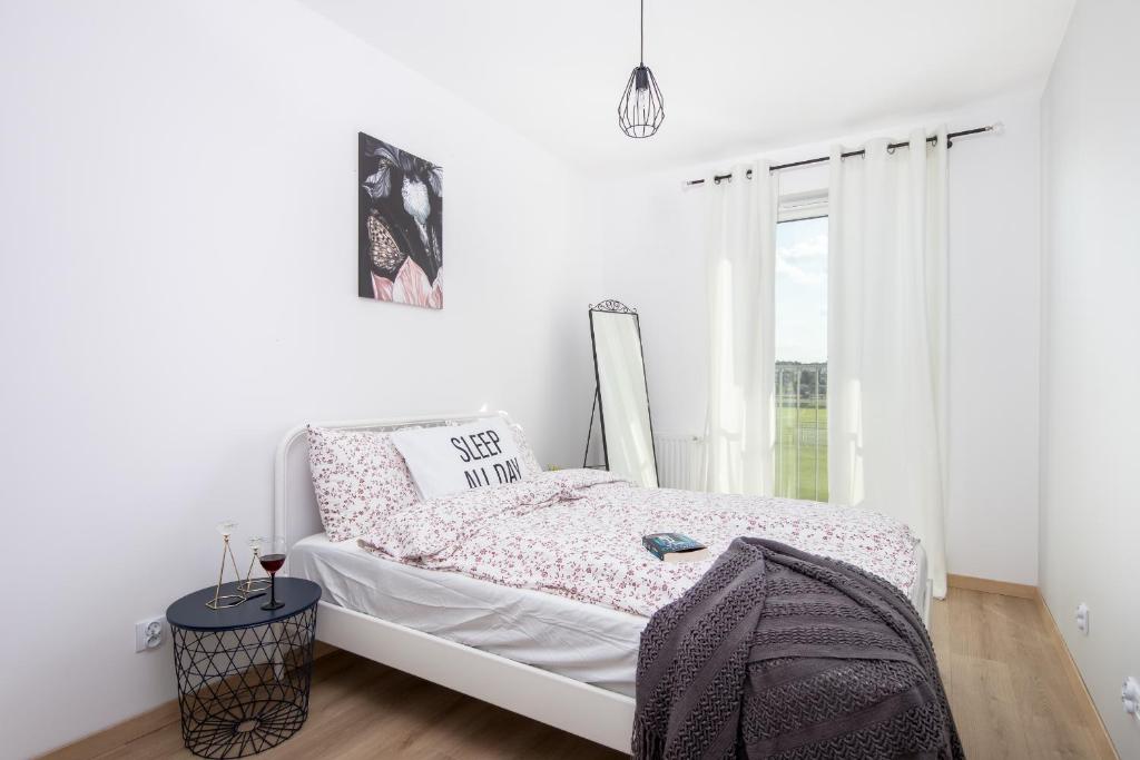 Posteľ alebo postele v izbe v ubytovaní Apartamenty Marii Konopnickiej Kraków