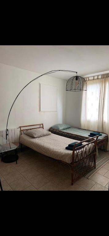 Posteľ alebo postele v izbe v ubytovaní Le Kerioubet - B&B au cœur du Pays d’Auge