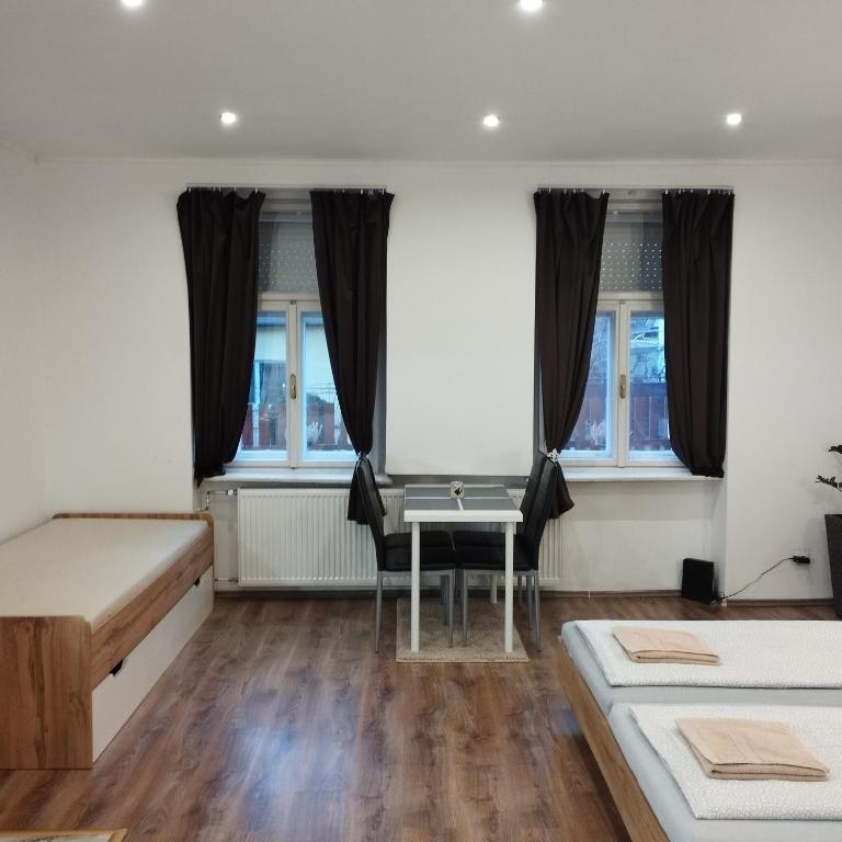 Postel nebo postele na pokoji v ubytování Apartmány 77