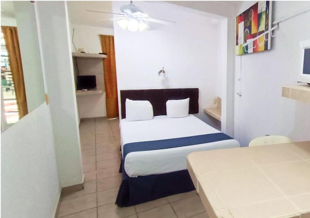 Postel nebo postele na pokoji v ubytování Tulipanes Cancun