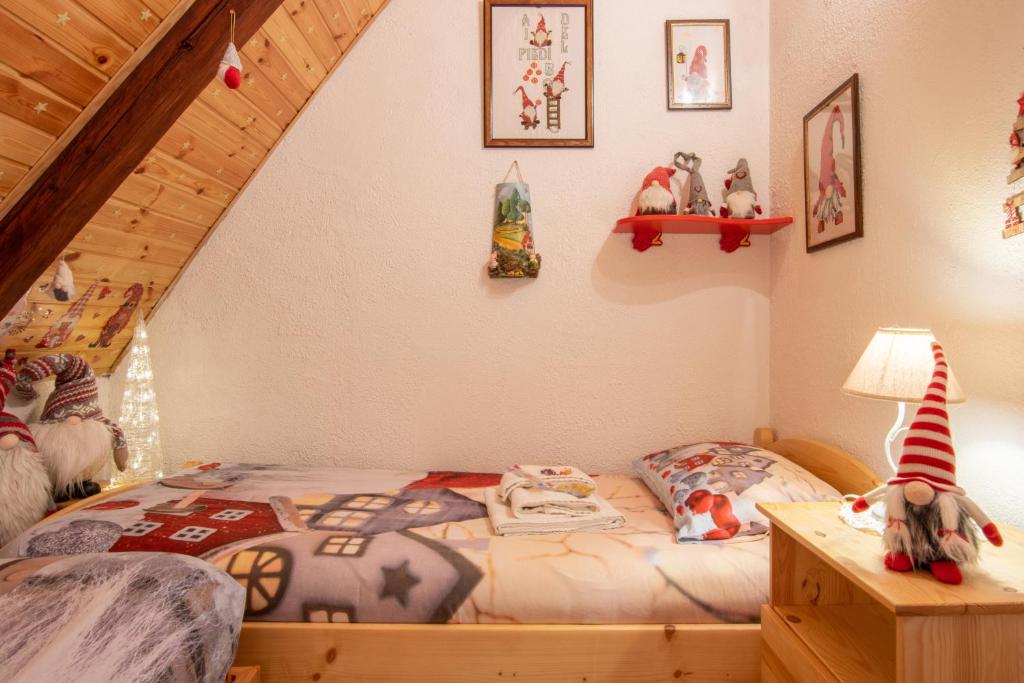 Posteľ alebo postele v izbe v ubytovaní CASA VACANZA "AI PIEDI DEL BOSCO"