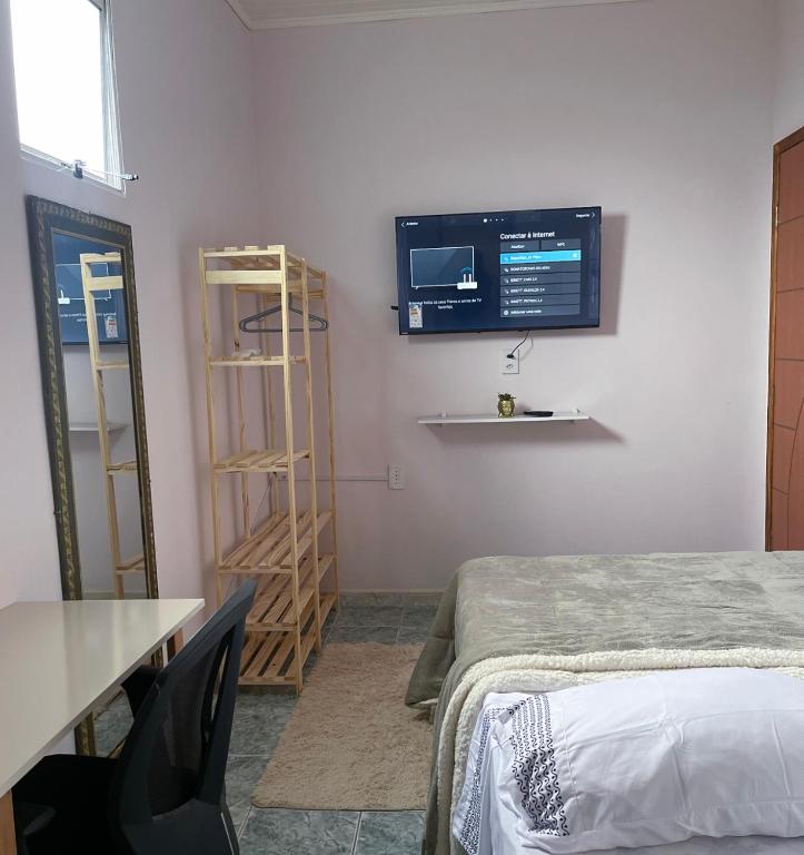 Postel nebo postele na pokoji v ubytování Residencial Napolitan