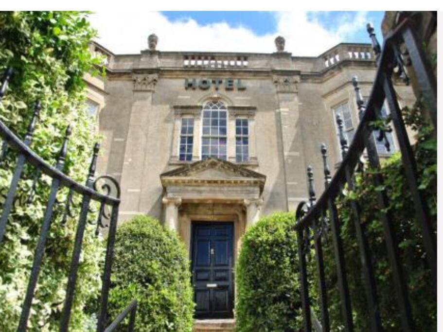 an entrance to a building with a blue door at 4 bed loft apartment overlooking historic town in Trowbridge