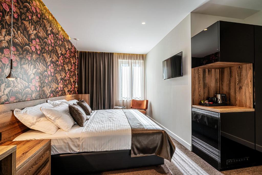 Postel nebo postele na pokoji v ubytování Calma Luxury Rooms
