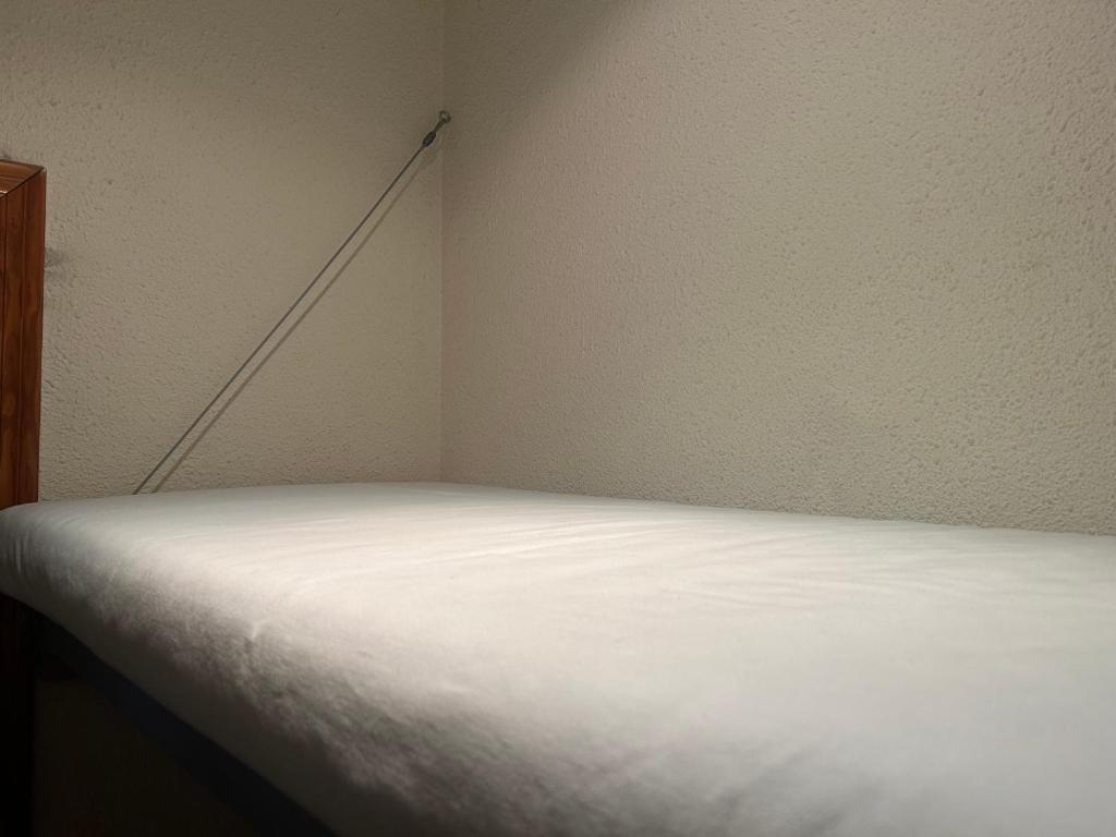 Postel nebo postele na pokoji v ubytování HotSpot Valencia