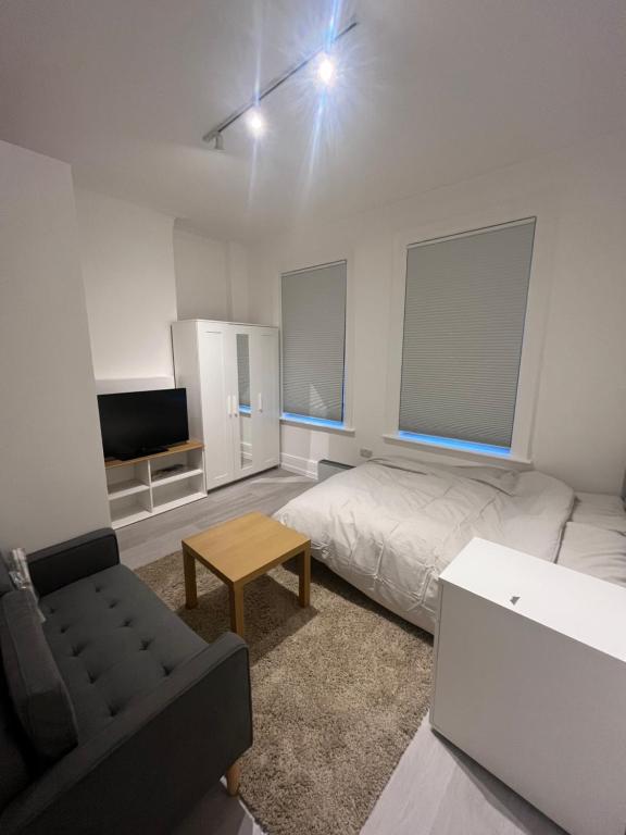 מיטה או מיטות בחדר ב-studio flat in Camden Town