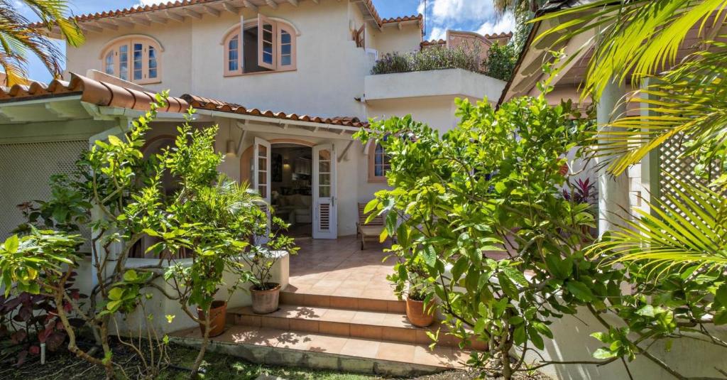 a house with a staircase leading to the front door at Sugar Hill, Coconut Shell by Barbados Sothebys International Realty in Saint James