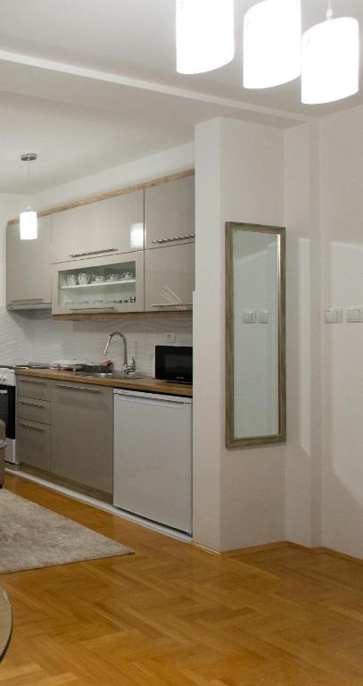 Kuchyň nebo kuchyňský kout v ubytování Apartman SUNSET