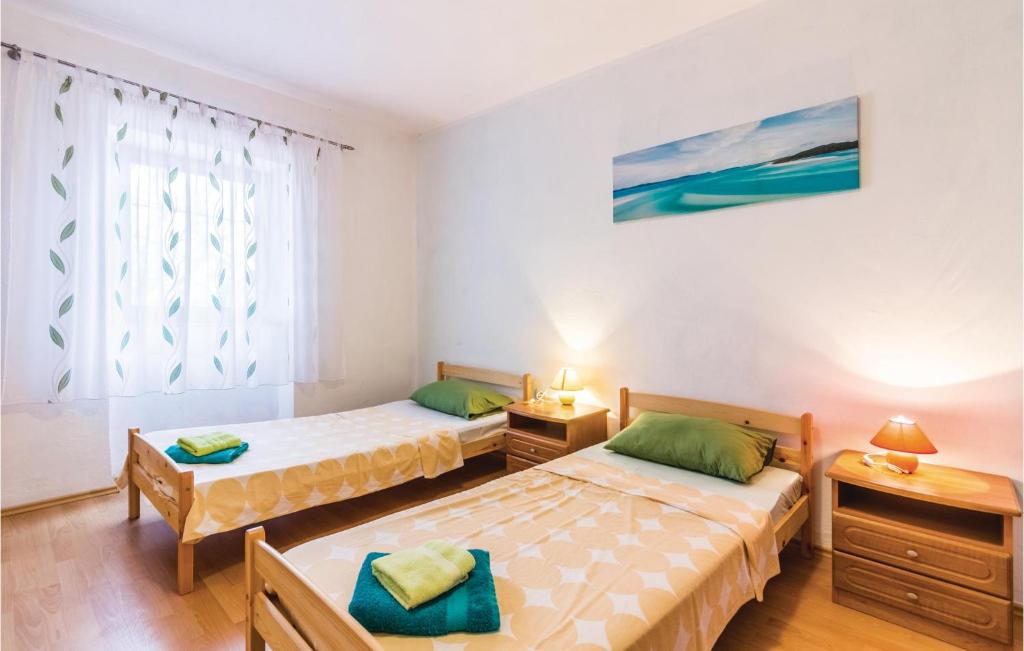 Łóżko lub łóżka w pokoju w obiekcie 3 Bedroom Stunning Apartment In Pula