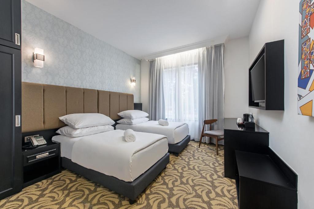 Postel nebo postele na pokoji v ubytování HAKO HOTEL JBCC