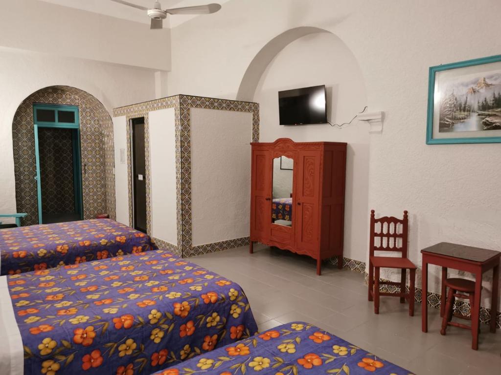 Postel nebo postele na pokoji v ubytování HOTEL LIMÓN