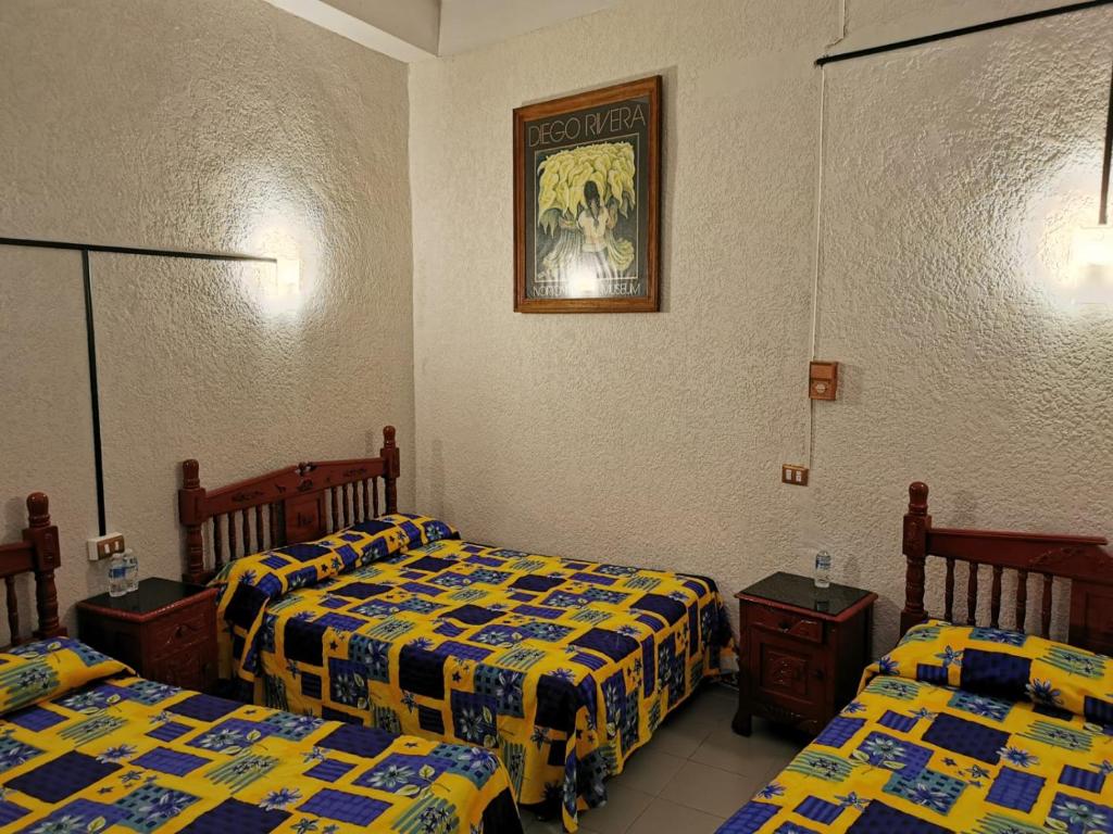 Postel nebo postele na pokoji v ubytování HOTEL LIMÓN