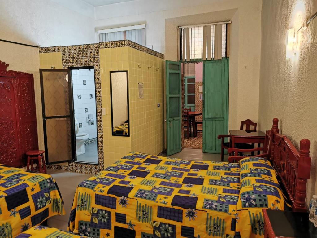 Postel nebo postele na pokoji v ubytování HOTEL LIMÓN