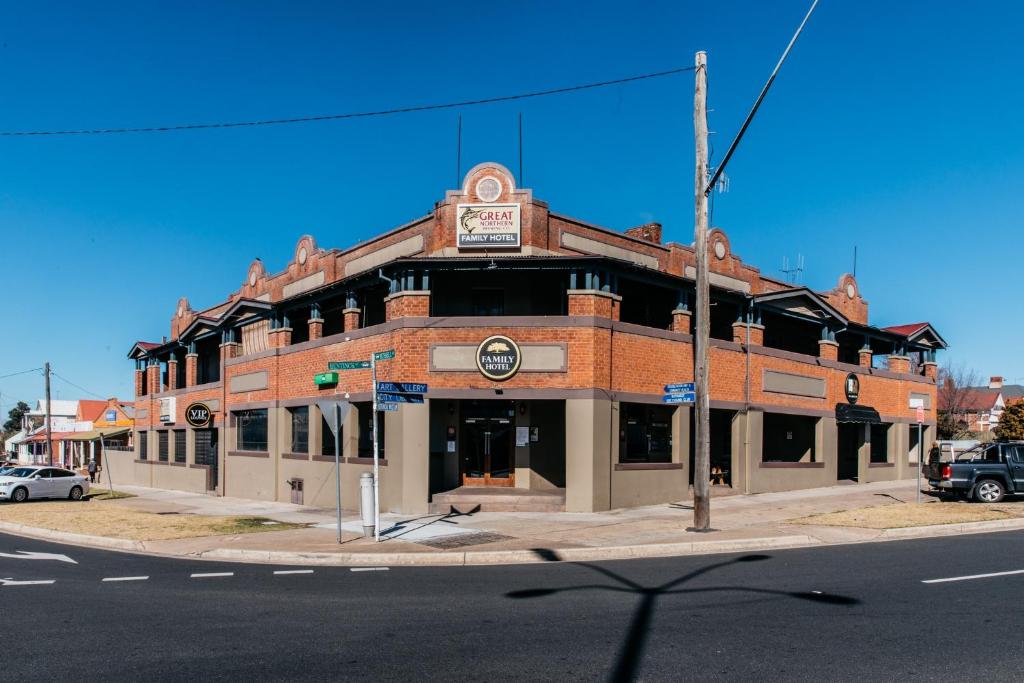 an old brick building on the corner of a street at Family Hotel in Bathurst