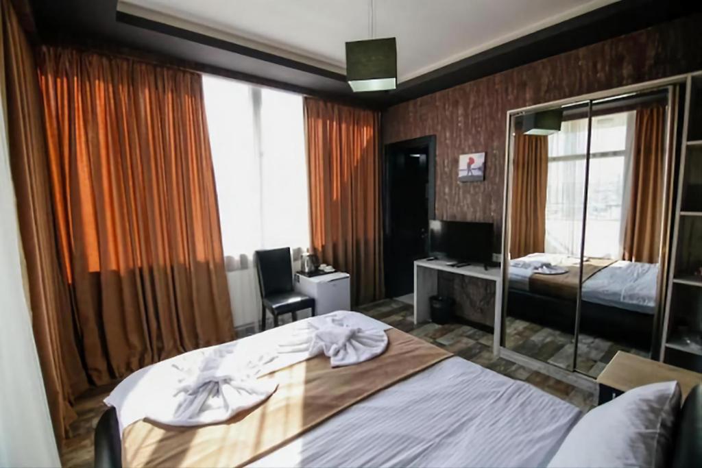 Postel nebo postele na pokoji v ubytování Panorama 360° Hotel