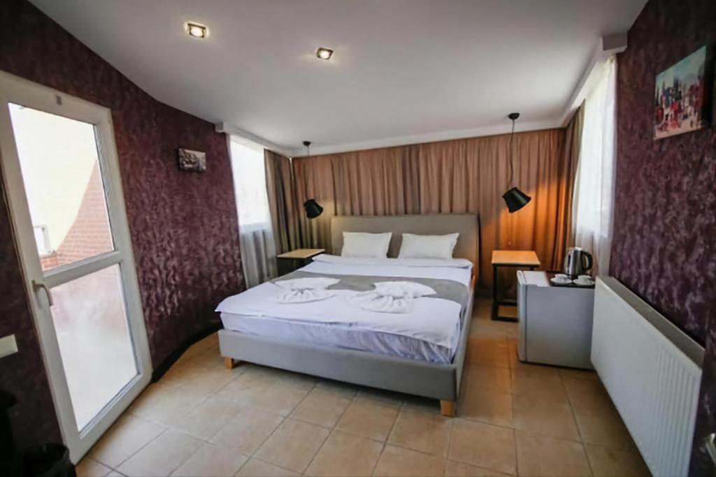 Postel nebo postele na pokoji v ubytování Panorama 360° Hotel