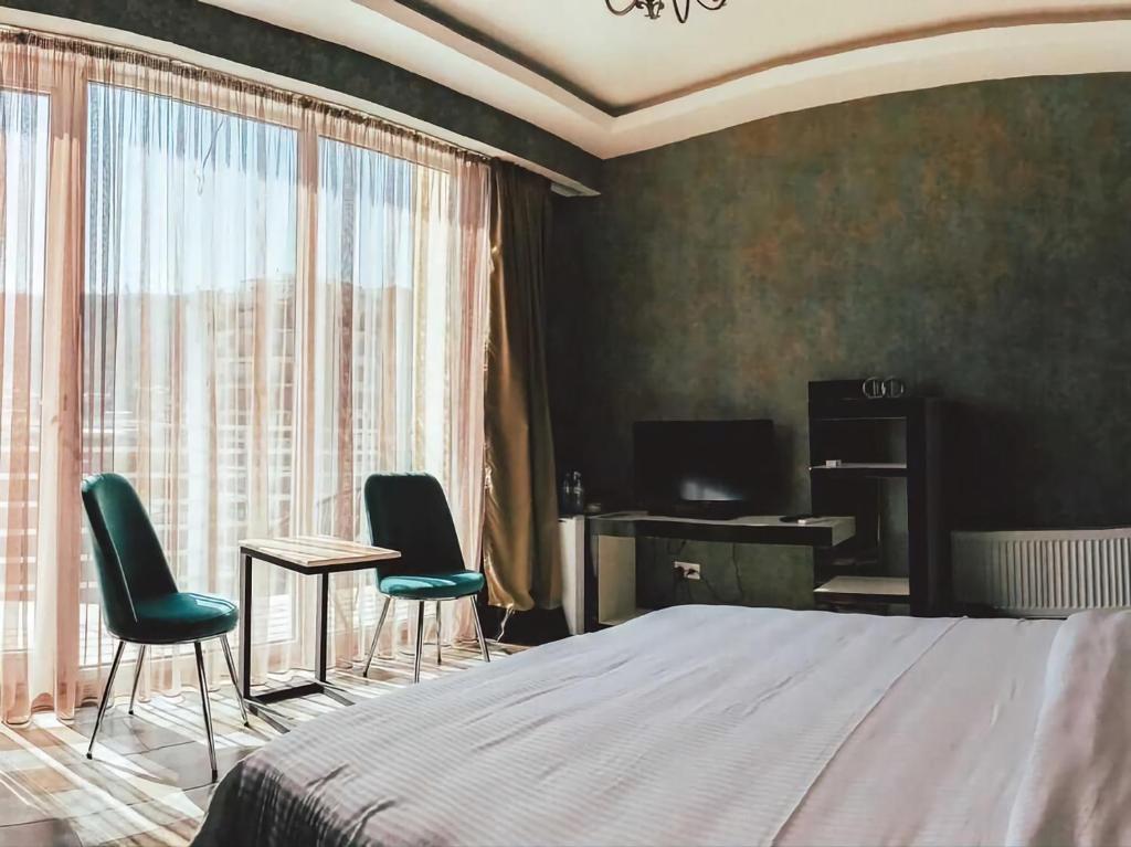 Postel nebo postele na pokoji v ubytování Panorama 360° Hotel
