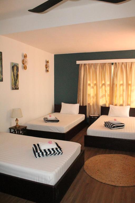 Postel nebo postele na pokoji v ubytování Villa Papillon