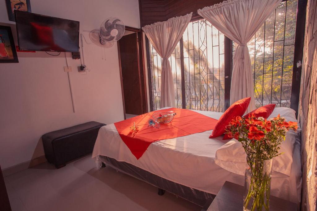 Postel nebo postele na pokoji v ubytování Hotel Palma De Sevilla