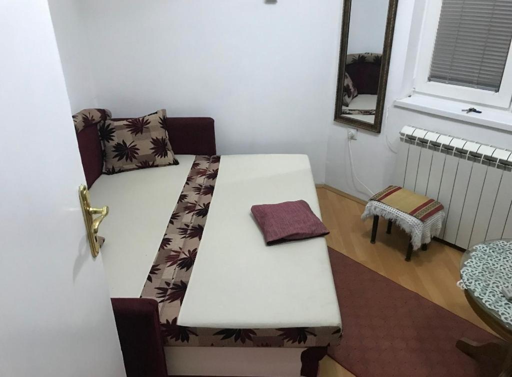 a white table in a room with a window at Dorćoleta in Belgrade