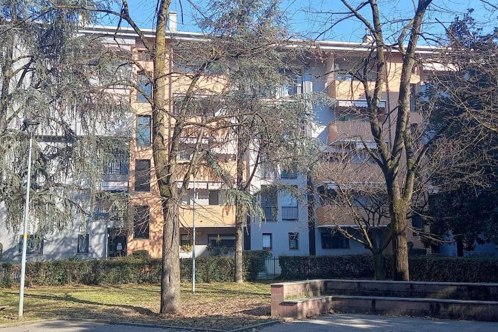 a large building with trees in front of it at Spilamberto 6b in San Donato Milanese