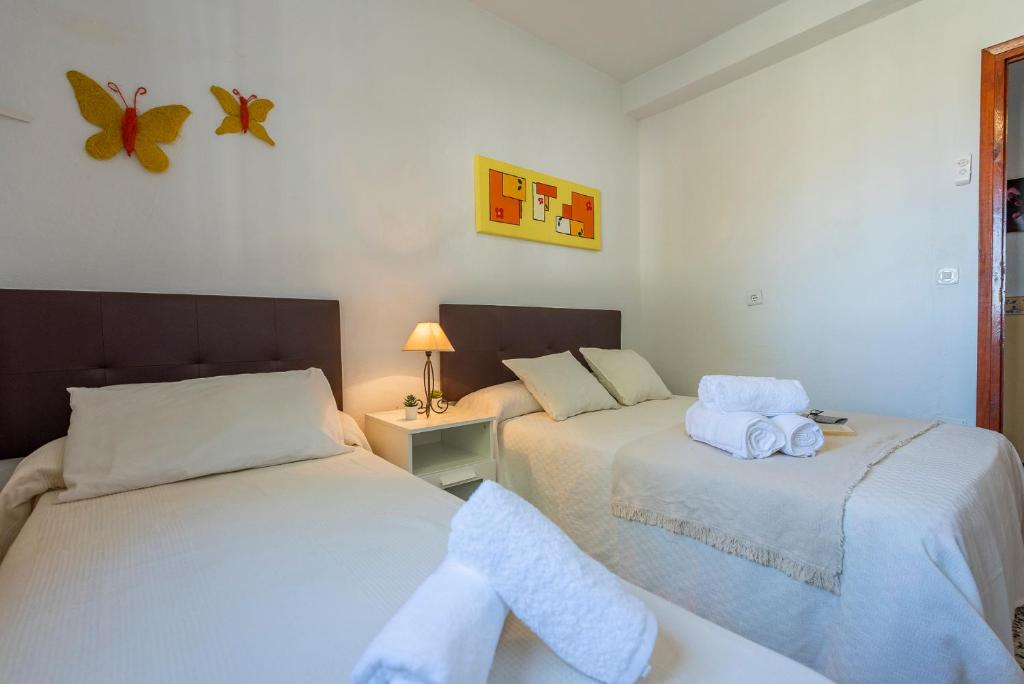 A bed or beds in a room at Los Algarrobos - Mountain and Relax near the beach