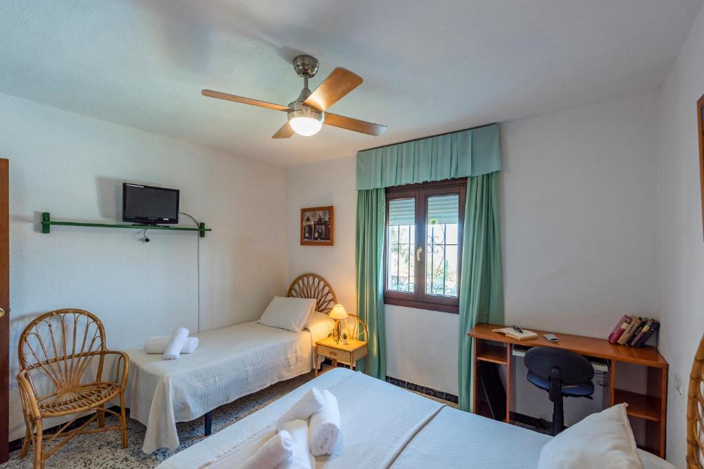 A bed or beds in a room at Los Algarrobos - Mountain and Relax near the beach