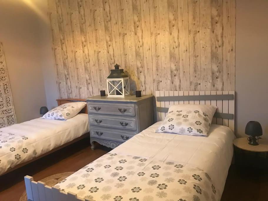 Кровать или кровати в номере Gîte spacieux et chaleureux