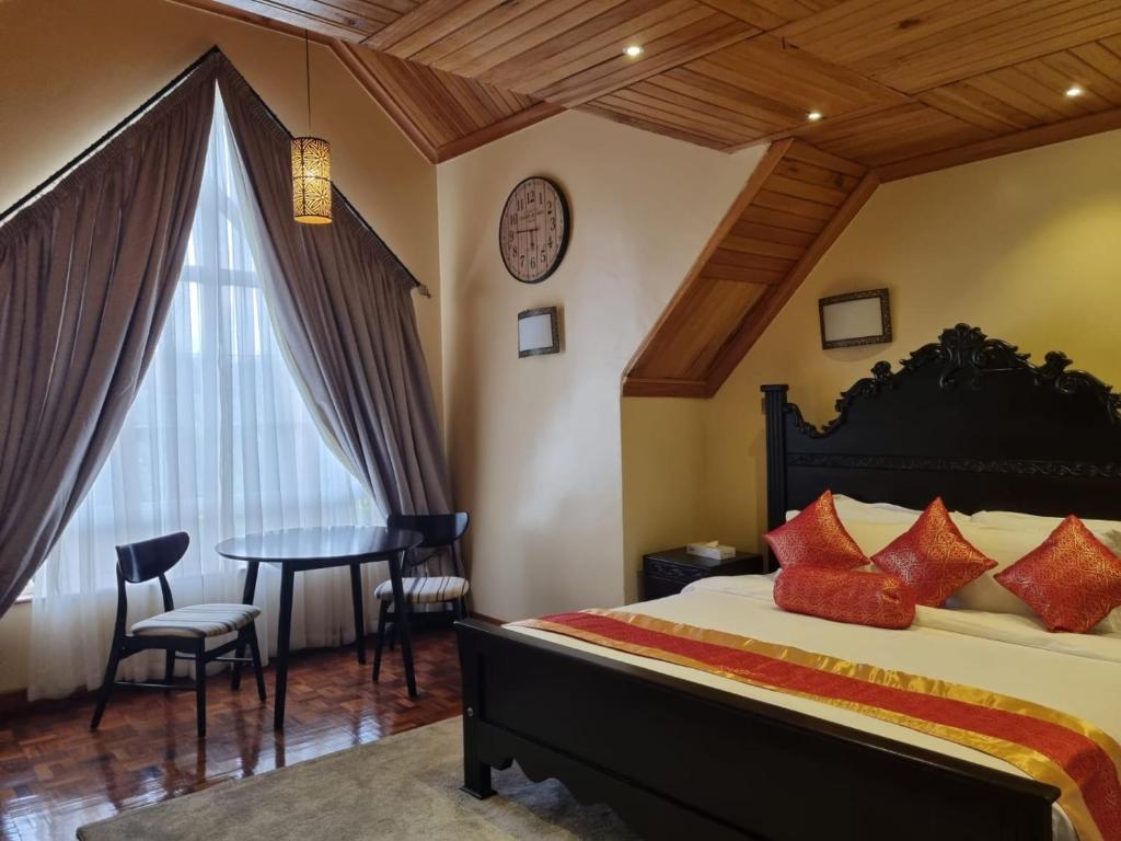 Postel nebo postele na pokoji v ubytování Asyana Gardens