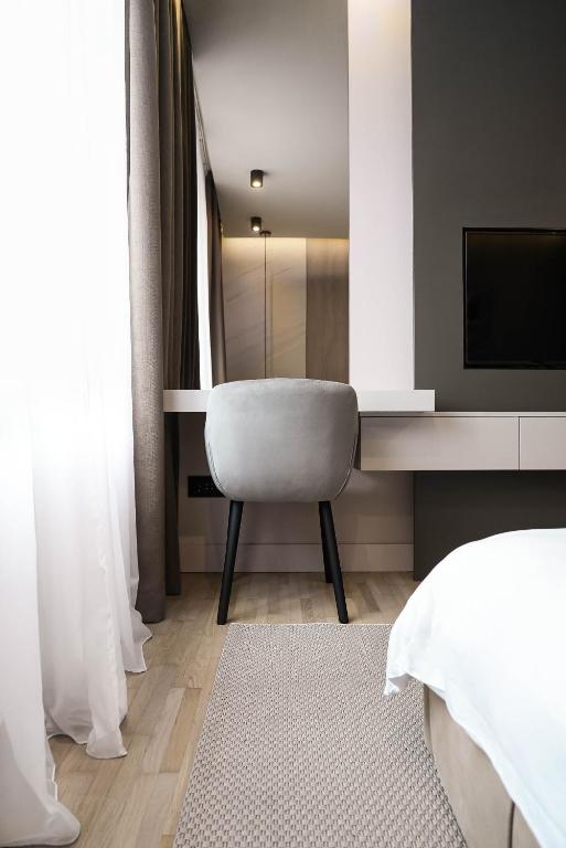 Postel nebo postele na pokoji v ubytování ZEST Residence