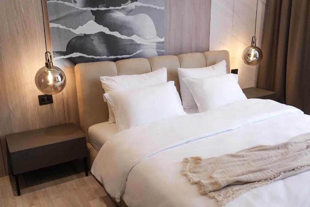 Postel nebo postele na pokoji v ubytování ZEST Residence