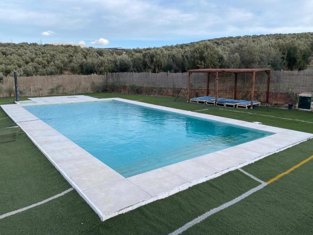 Bazén v ubytovaní Hacienda Los Olivos Alora Grupos grandes Fiestas Pista de padel alebo v jeho blízkosti