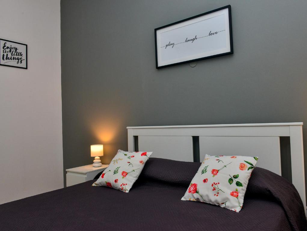 A bed or beds in a room at Amaryllis Apartments