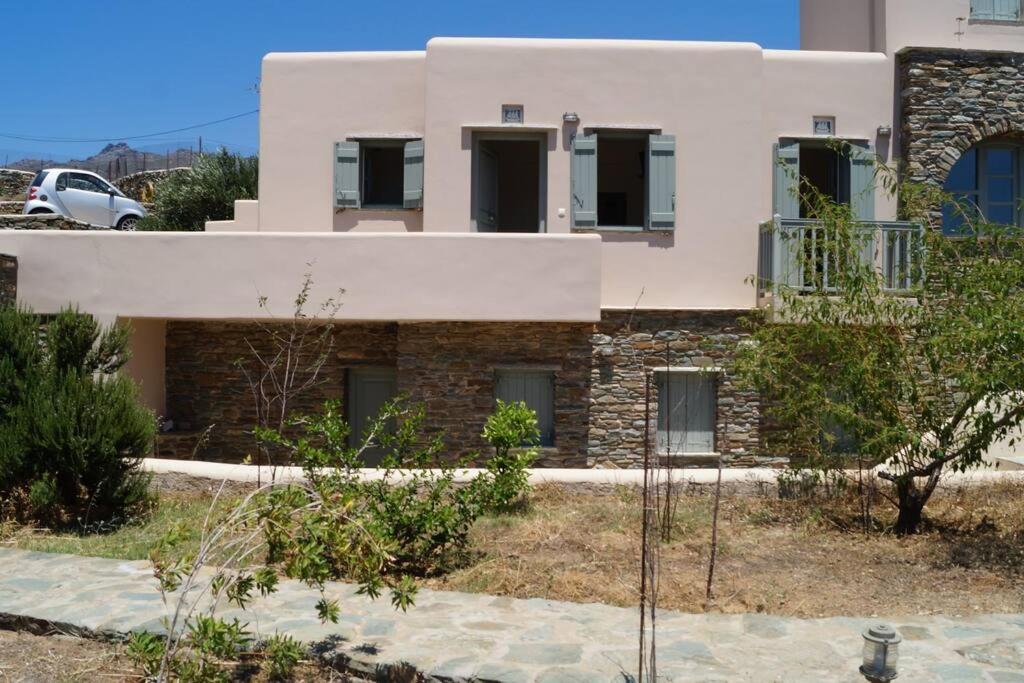 a house in the middle of a yard at M. Houses 3 in Agios Romanos