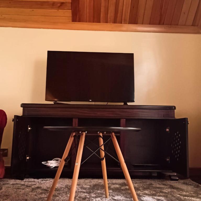 TV a/nebo společenská místnost v ubytování Asyana Gardens