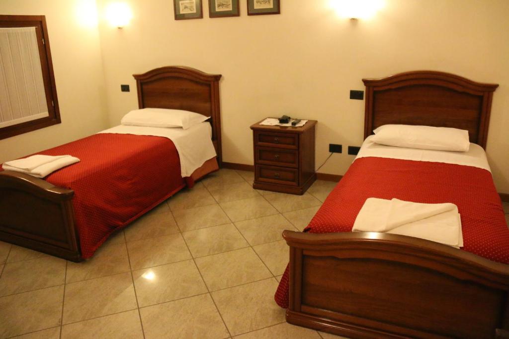 Posteľ alebo postele v izbe v ubytovaní Hotel Ristorante Regina