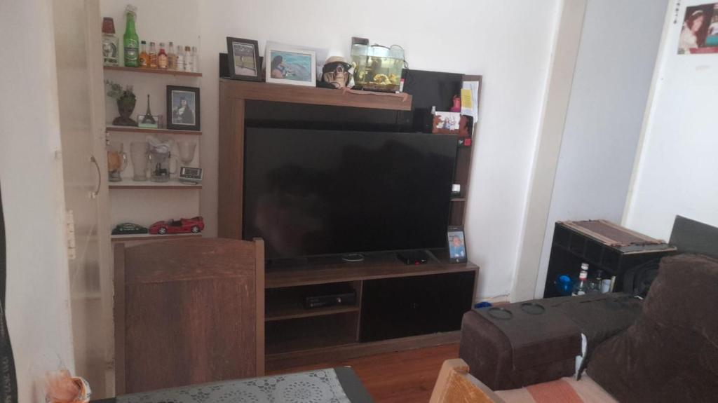 a living room with a large flat screen tv at apartamento copa in Rio de Janeiro
